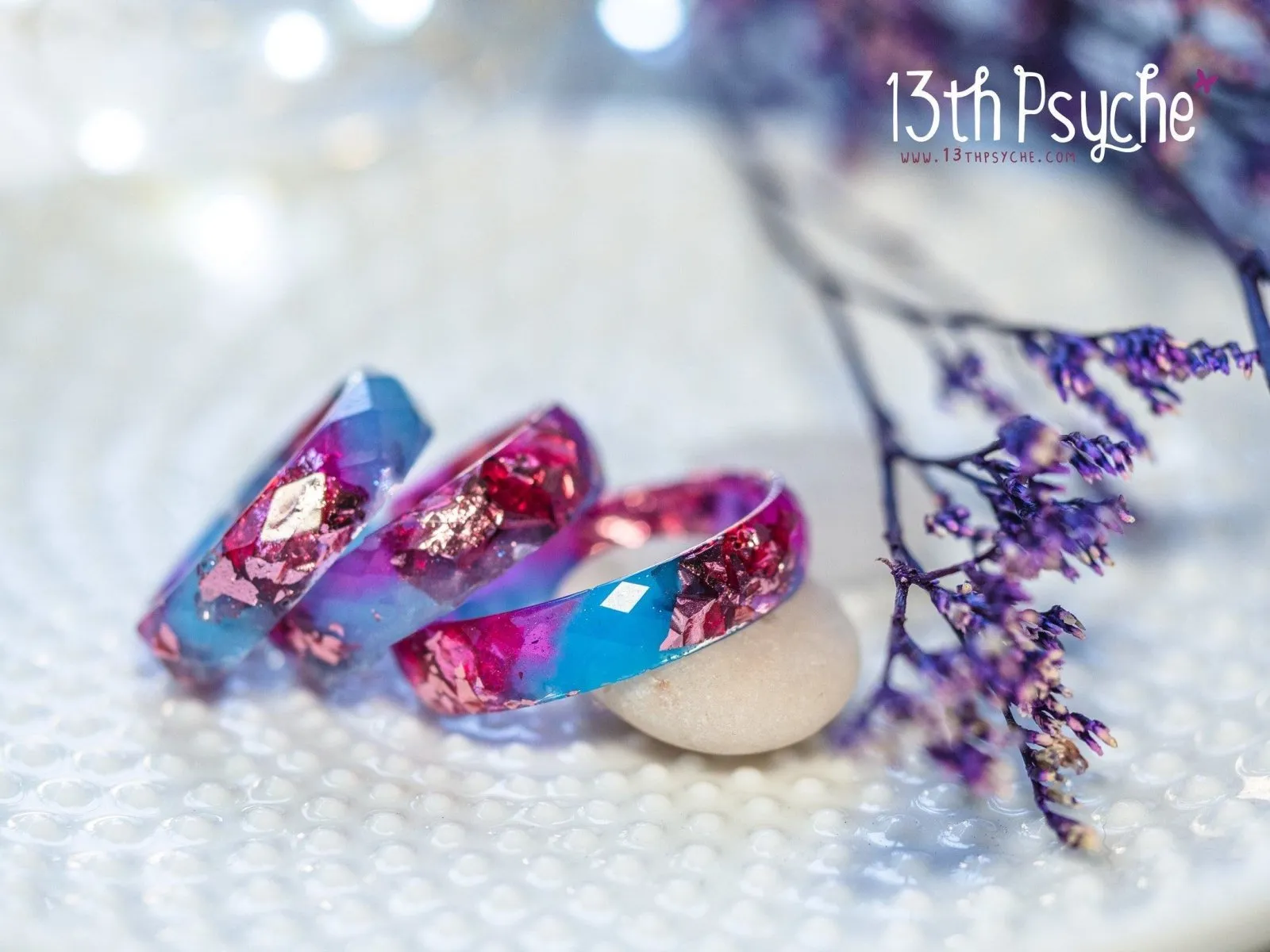 Blue and fuschia faceted resin ring with pink metallic flakes