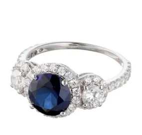 Faux Sapphire Cubic Zirconia Three Stone Halo Engagement Ring In Sterling Silver